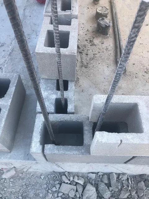 Reinforced, grouted block cells with rebar