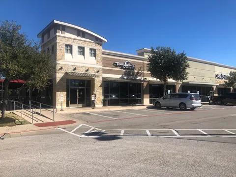 Finished commercial retail building with stone masonry