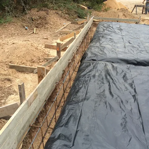 Formed foundation with rebar and a vapor barrier