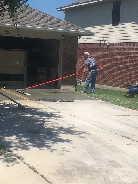 Screeding a new concrete driveway