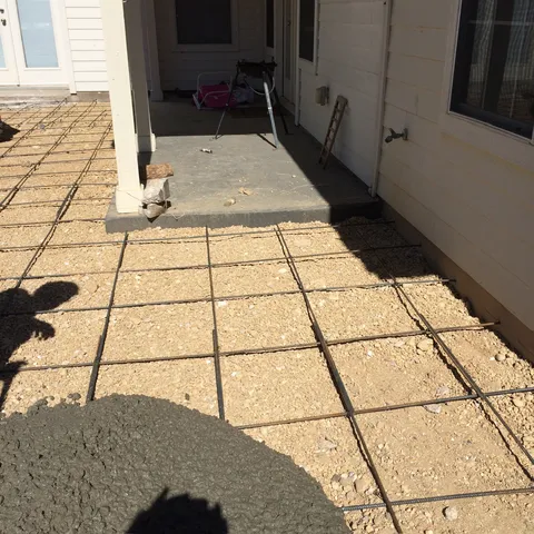 Rebar-reinforced concrete slab during a pour
