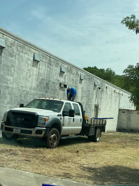 Company flatbed truck at a commercial jobsite
