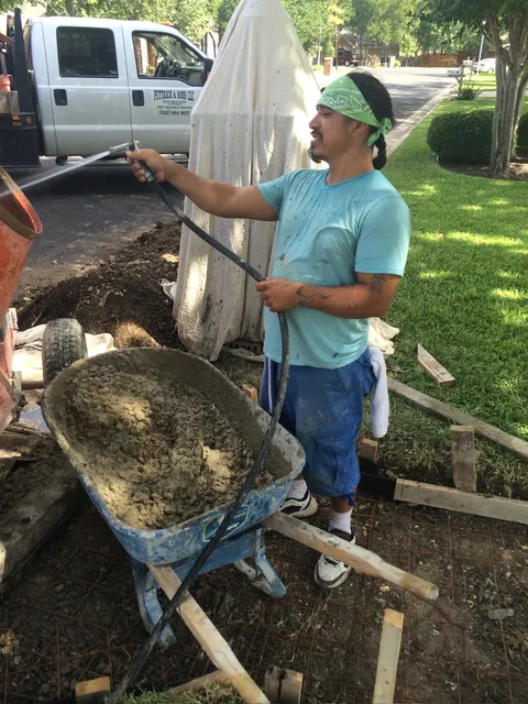 Crew member moving material during a walkway job