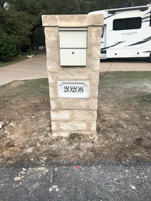 Stone mailbox column with an address plate