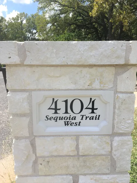 Stone address column with an engraved plaque