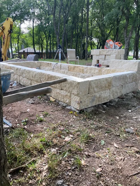 Building a low stone wall on a rural lot