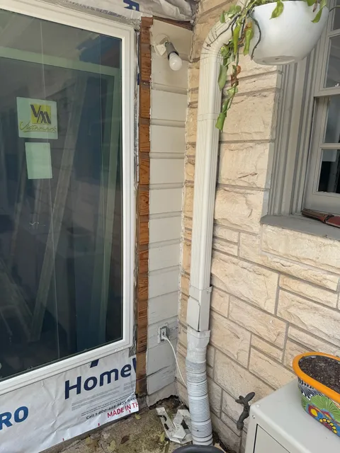 Stone veneer going up on an exterior corner